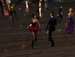 A diverse group of stylish avatars dancing at a party in Alife Virtual World